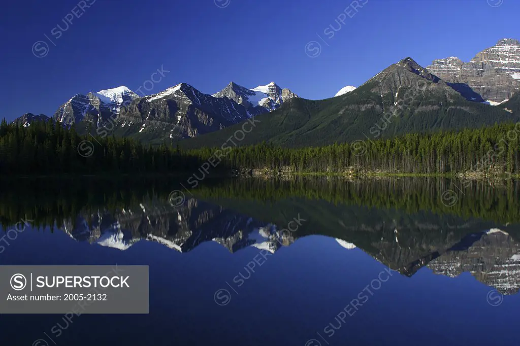 Reflection of mountains in water, Lake Herbert, Wenkchemna Peaks, Banff National Park, Alberta, Canada