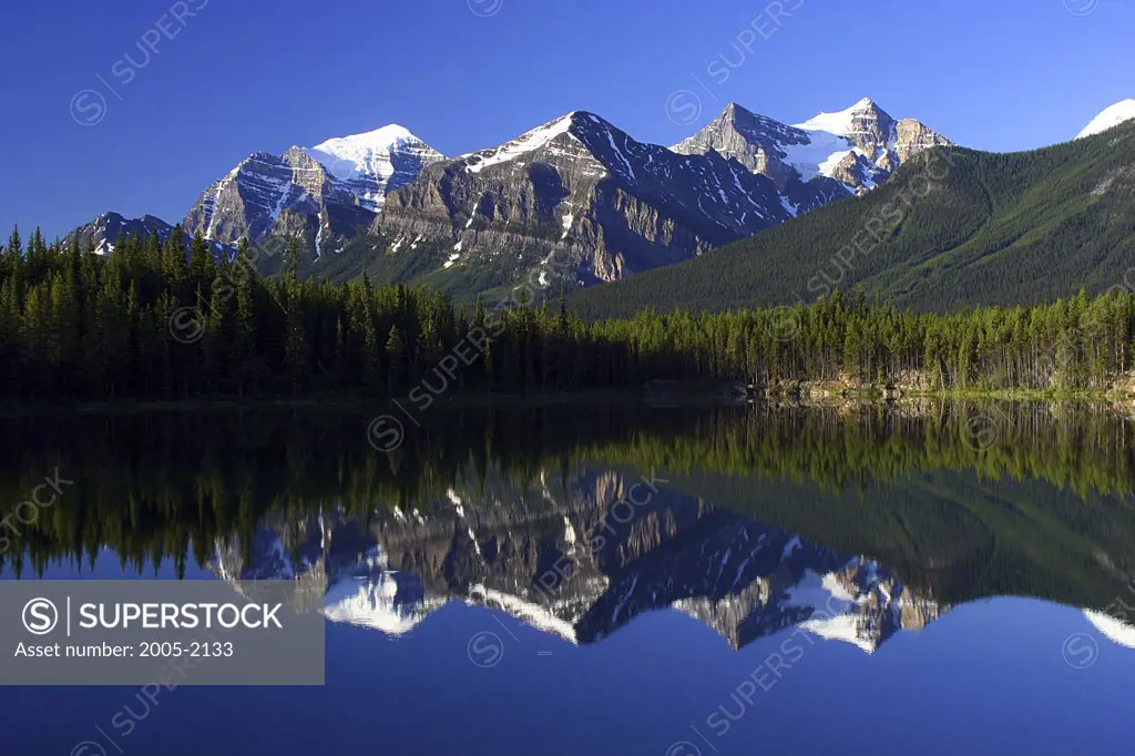 Reflection of mountains in water, Lake Herbert, Wenkchemna Peaks, Banff National Park, Alberta, Canada
