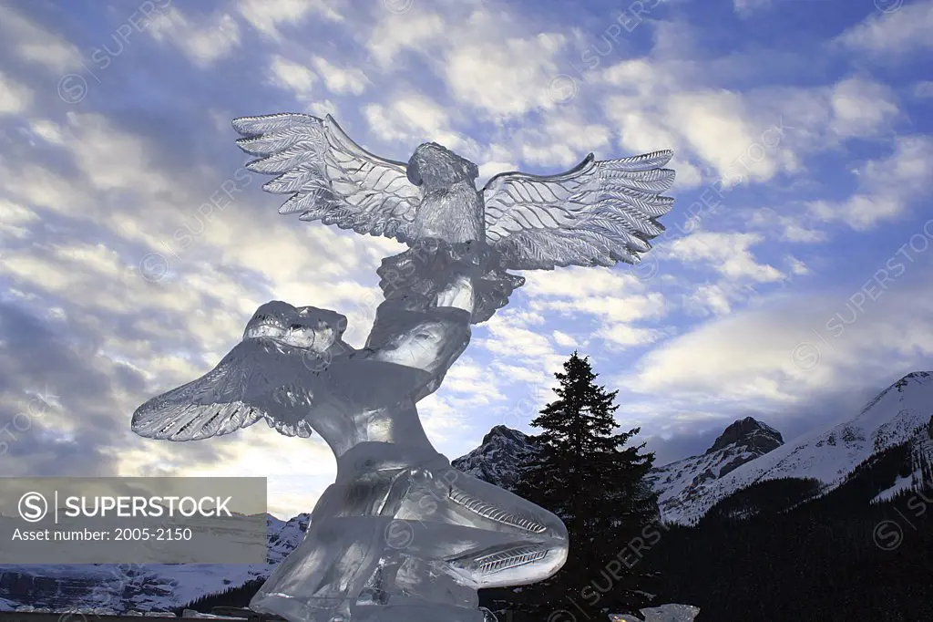 Low angle view of an ice sculpture with mountains in the background, Mount Victoria, Banff National Park, Alberta, Canada