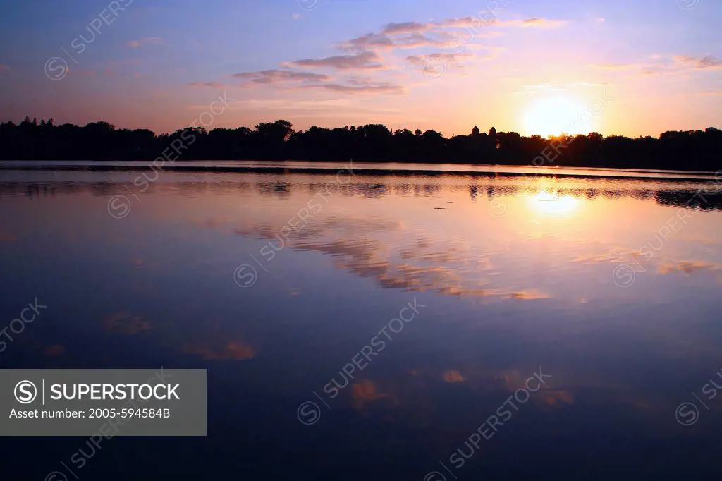 Reflection of clouds in a lake at sunset, Minnesota, USA
