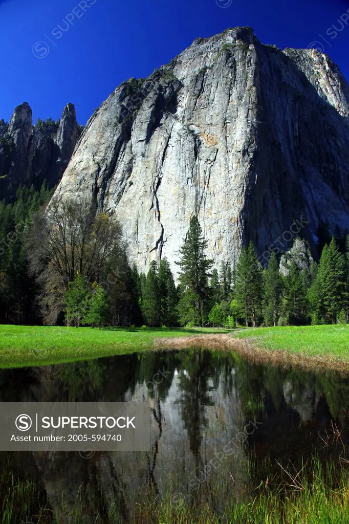 Reflection of rocks in a pond, Cathedral Rocks, Yosemite National Park, California, USA