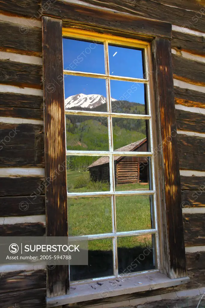USA, Colorado, White Mountain National Forest, Ashcroft, Ghost town window reflection