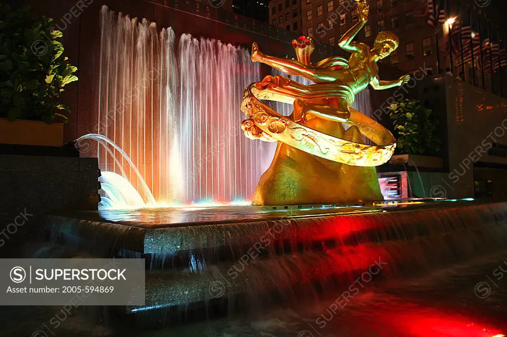USA, New York, New York City, Rockefeller Center, Prometheus Statue and fountain at night