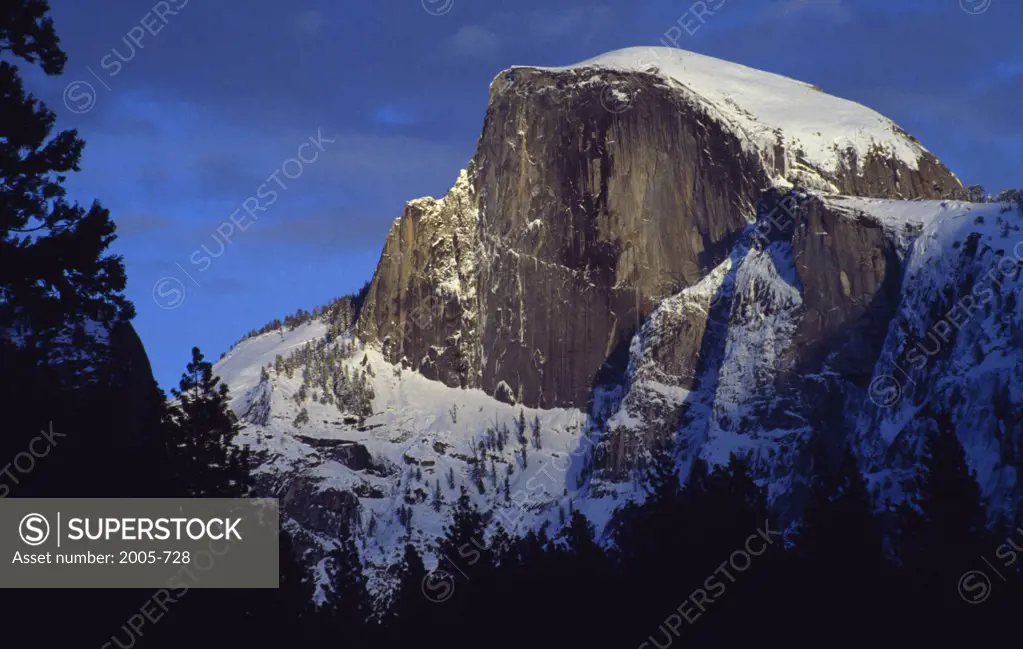 Low angle view of a snow covered mountain, Half Dome, Yosemite National Park, California, USA