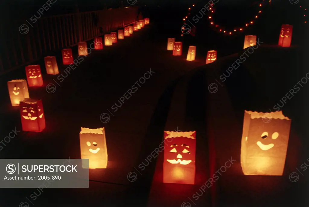 Lanterns in a row lit up at night