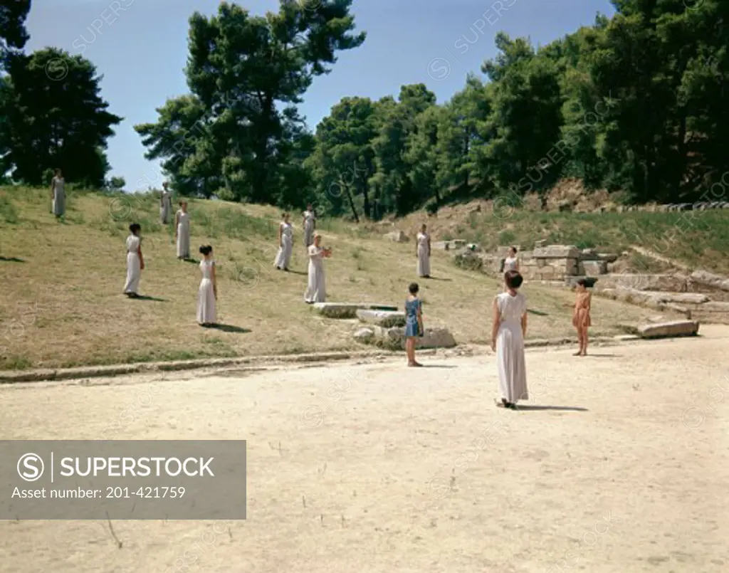 Group of people standing in a park, Olympia, Greece