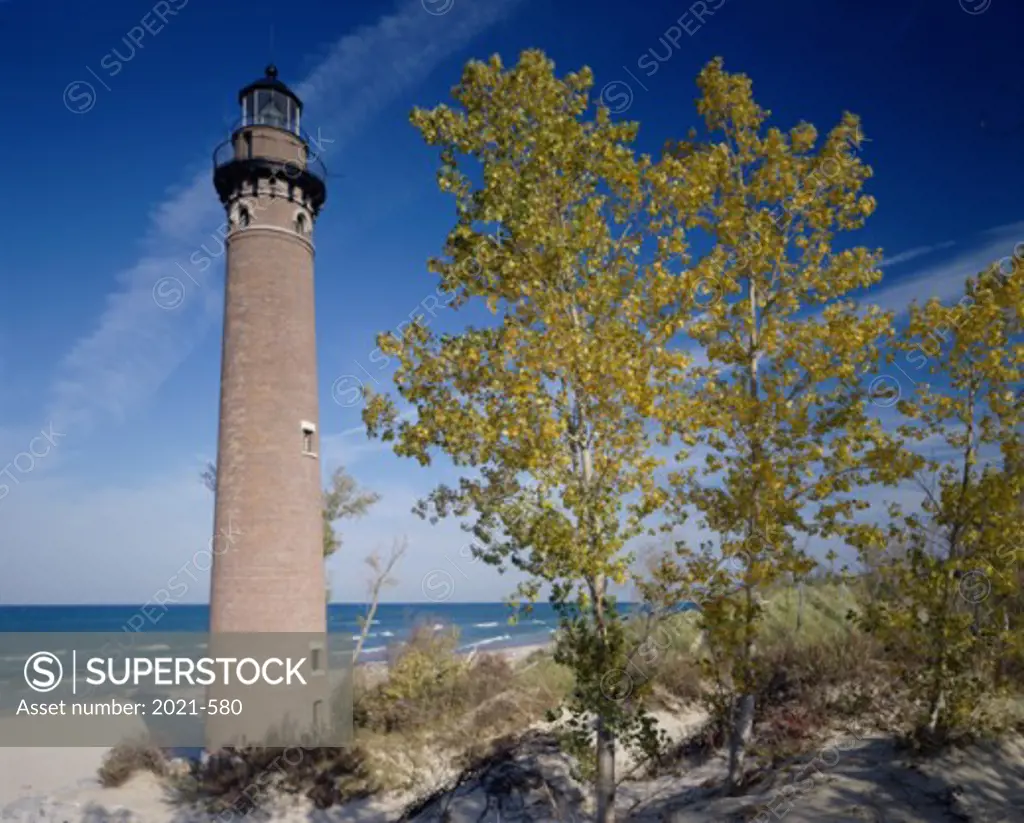 Low angle view of a lighthouse on the beach, Little Point Sable Lighthouse, Silver Lake State Park, Michigan, USA