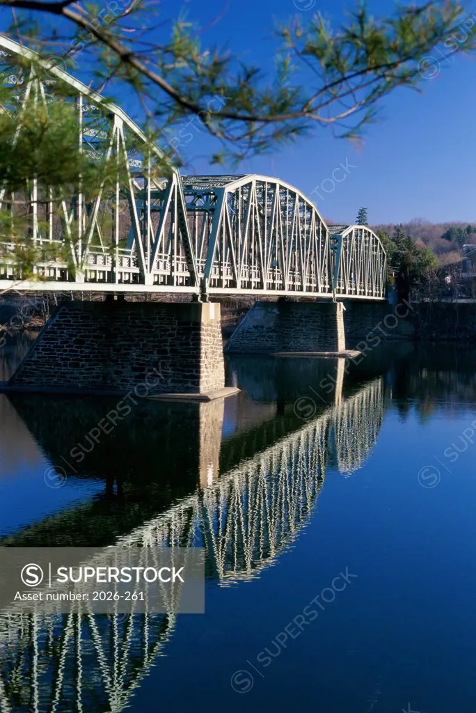Reflection of a bridge in a river, Milford-Black Eddy Bridge, Delaware River, Milford, New Jersey, USA
