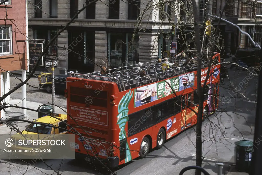 Buses and cars on a street in Soho, New York City, New York, USA