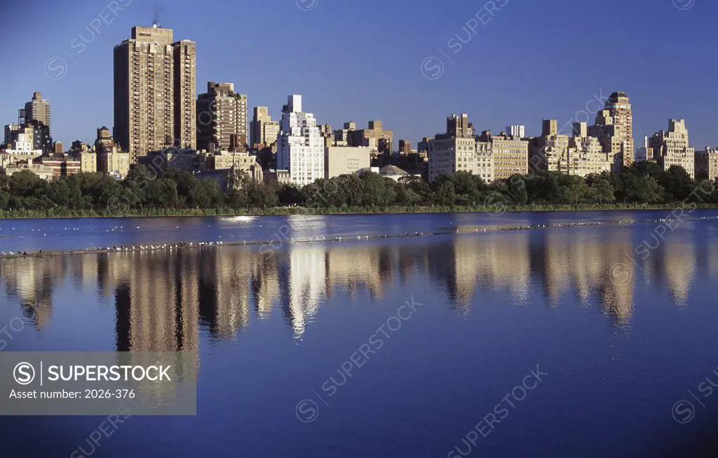 Reflection of buildings in a river, New York City, New York, USA
