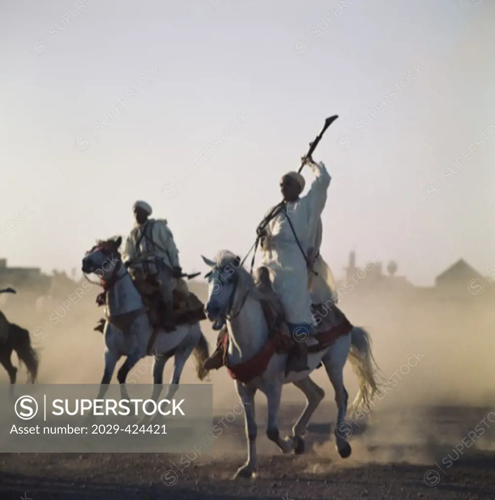 Men riding horses, Berbers, Marrakesh, Morocco