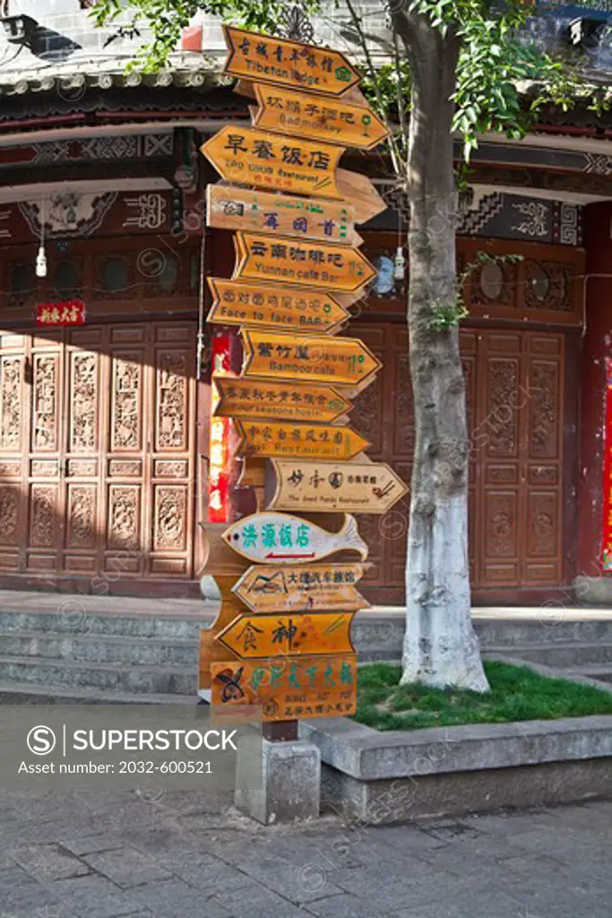 China, pole with information signs