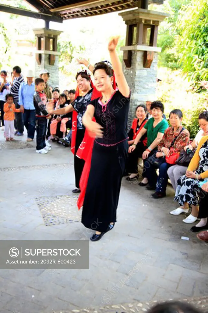 China, Kunming, Women dancing in front of audience
