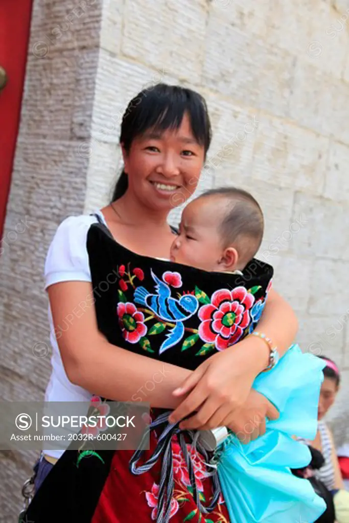 China, Kunming, Portrait of mother with baby son