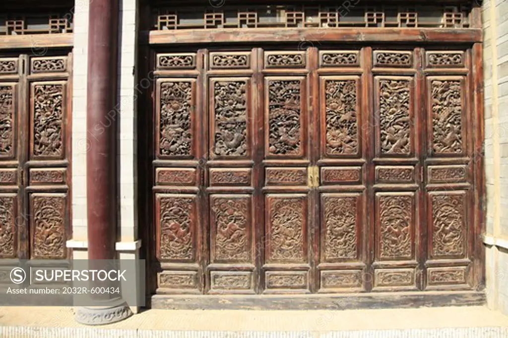 China, Kunming, Wooden wall with reliefs