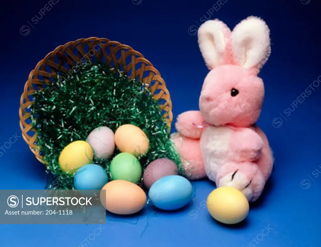 Close-up of an Easter Bunny with multi-colored eggs