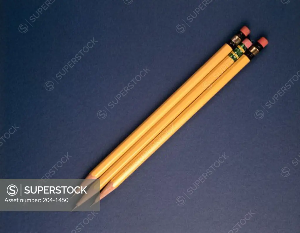 Close-up of three pencils