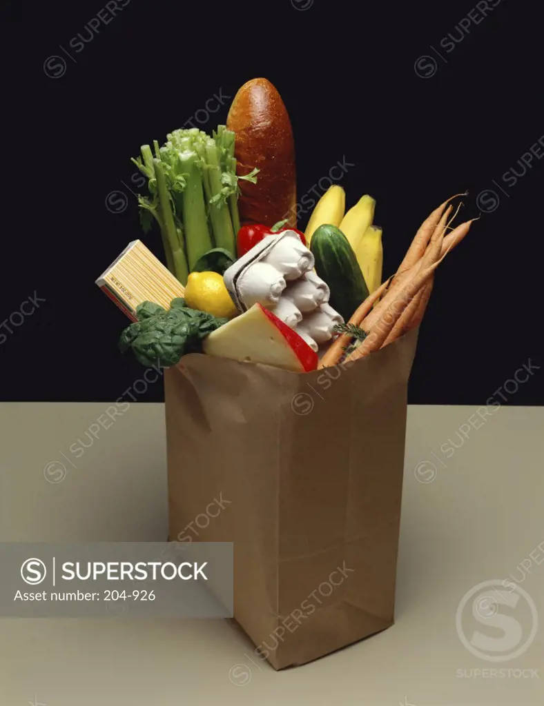 Close-up of groceries in a paper bag