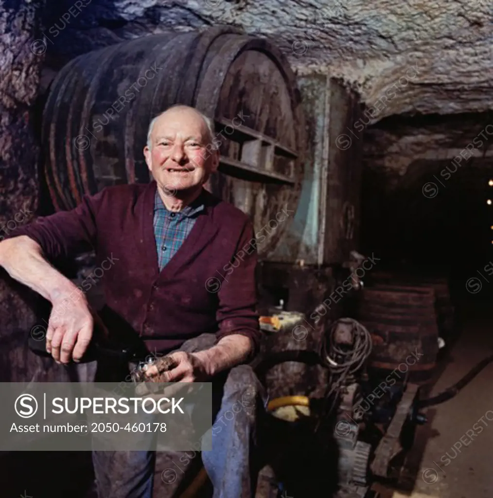 Man standing in a Wine Cellar, Loire Valley, France