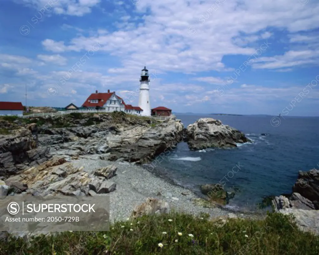 Lighthouse on the rocky shore, Portland Head Lighthouse, Cape Elizabeth, Maine, USA