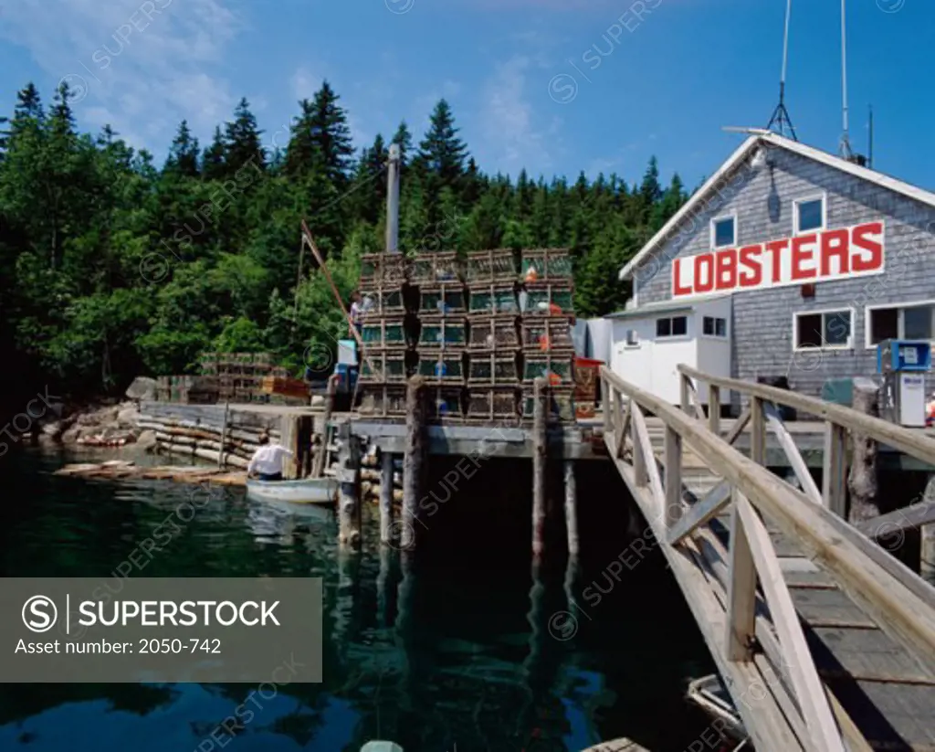 Lobster traps in front of an establishment on the harbor, Lobster Pound, Stonington, Maine, USA