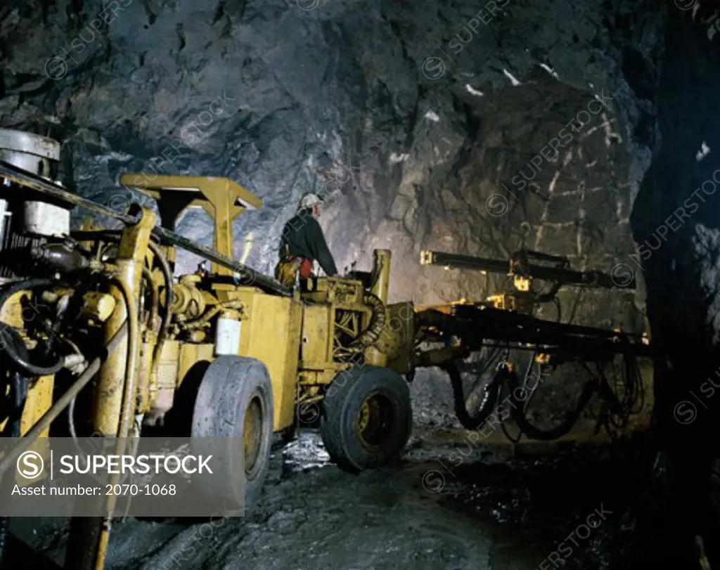 Man operating mining machinery, Twin Boom Drill, Lead and Zinc Mine, Watson Lake, Yukon, Canada