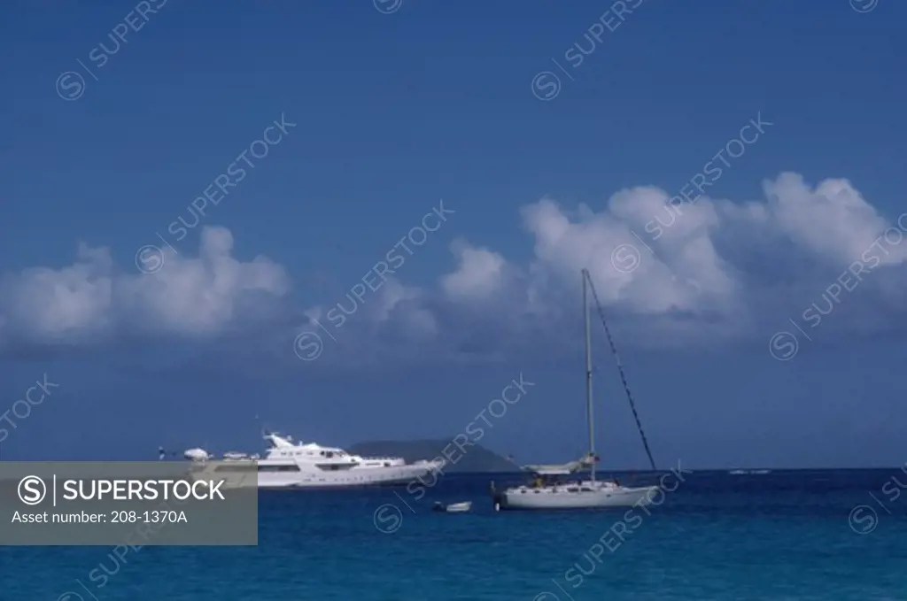 Yacht and a sailboat in the sea