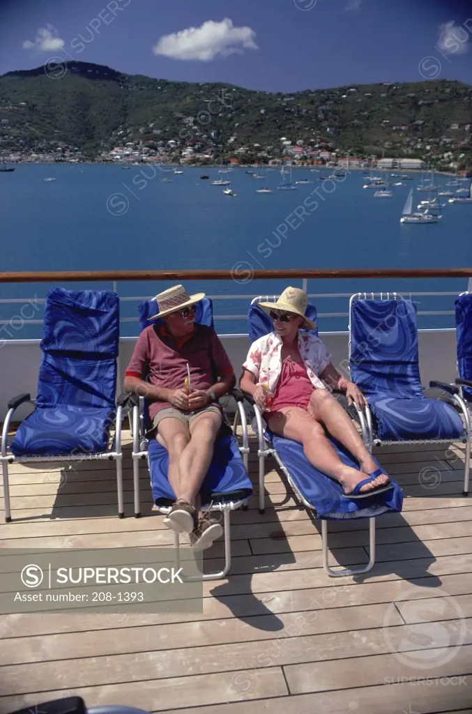 High angle view of a senior couple sitting in lounge chairs