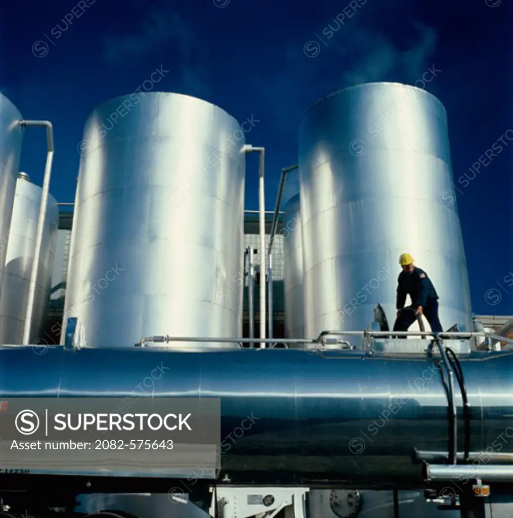 Chemical worker loading PVA Alcohol Tanks