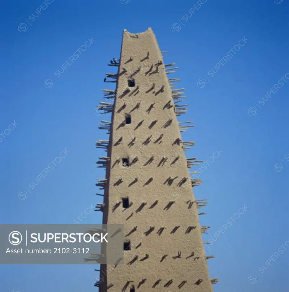 Low angle view of a spiked tower of a mosque, Agadez, Niger