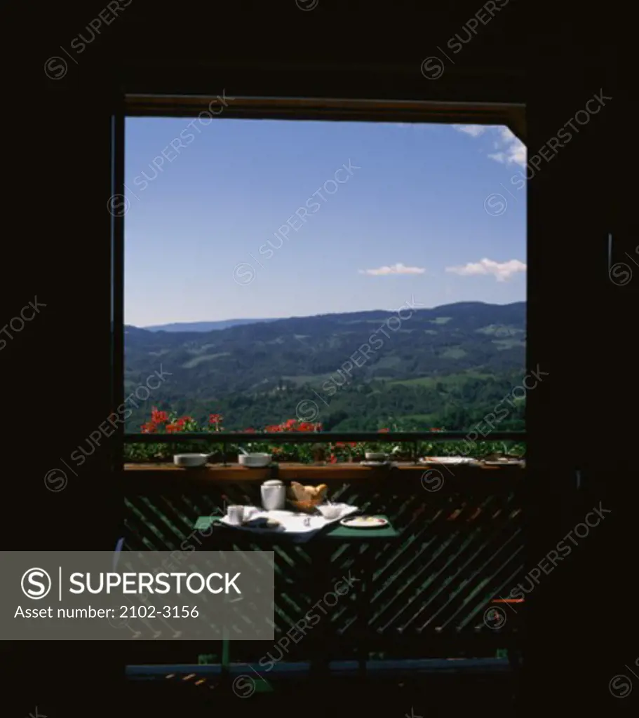Panoramic view of mountains seen through a door, Buschenschank, Austria