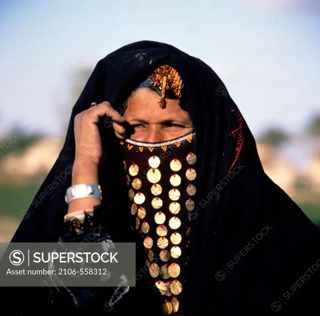 Egypt, Faiyum, portrait of woman wearing traditional clothing