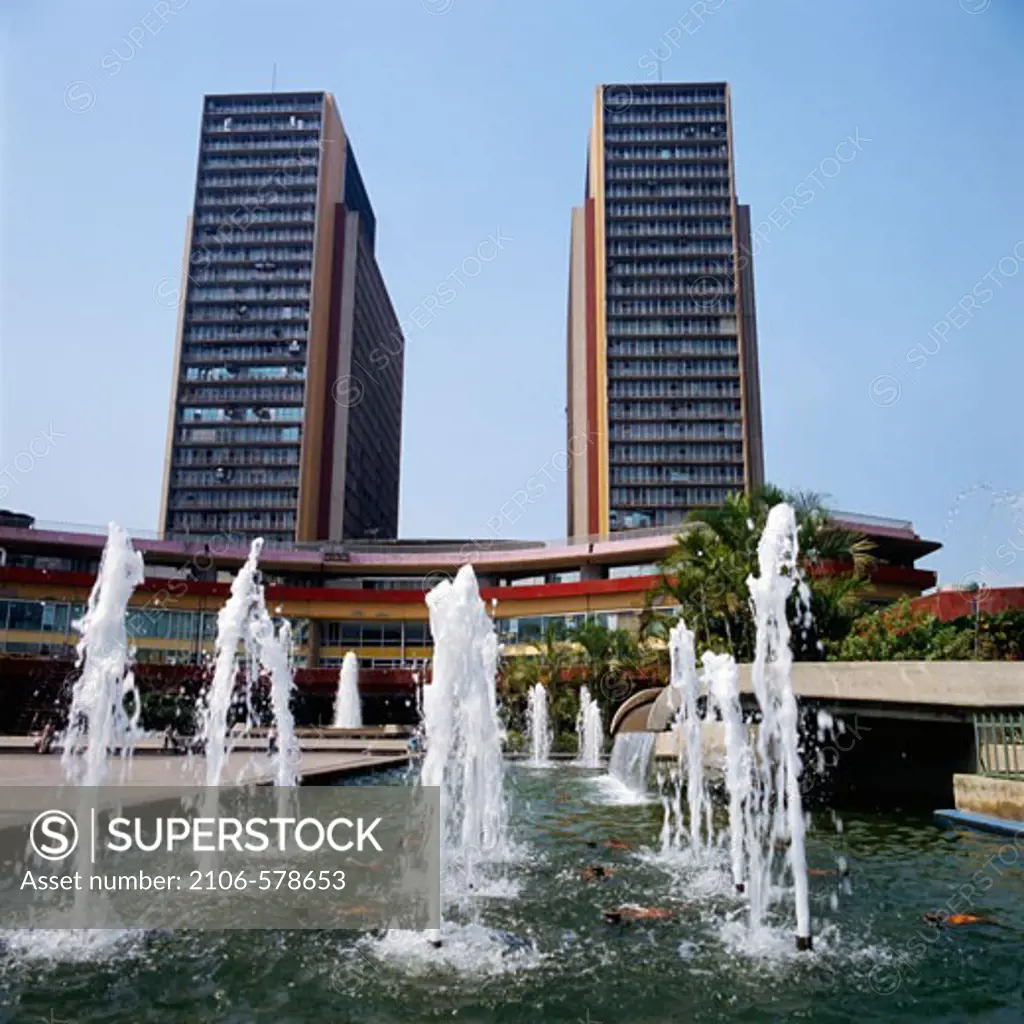 Venezuela, Caracas, Simon Bolivar Center, Fountains in front of skyscrapers
