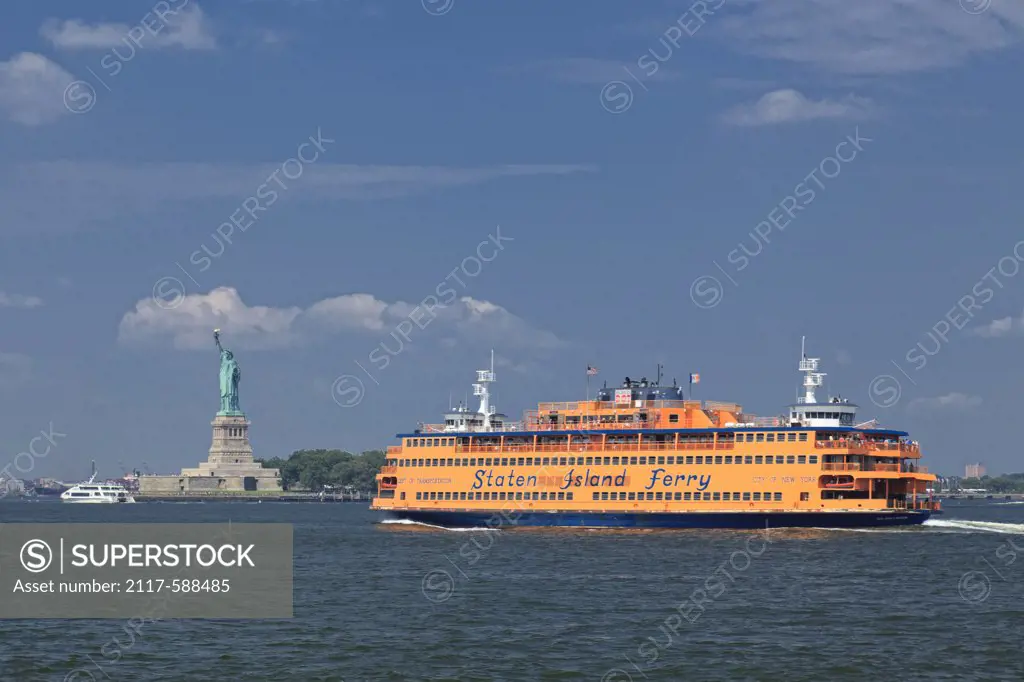 USA, New York City, Staten Island Ferry crossing New York Harbor with Statue of Liberty in background