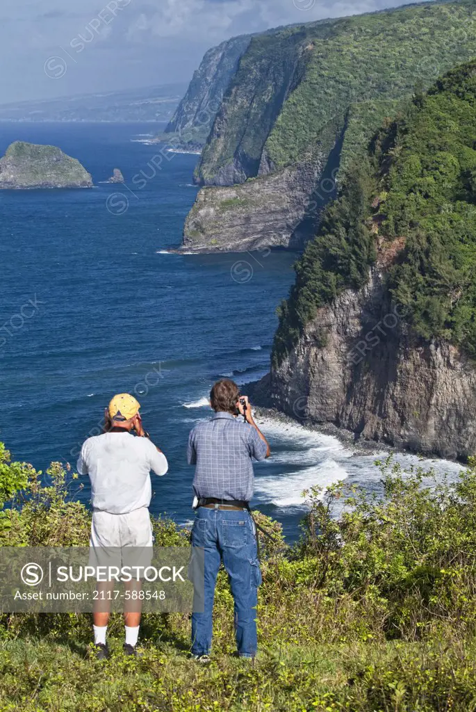 Tourists taking pictures of the ocean, Pololu Valley, Big Island, Hawaii, USA