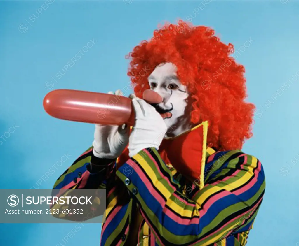Clown blowing up balloon 