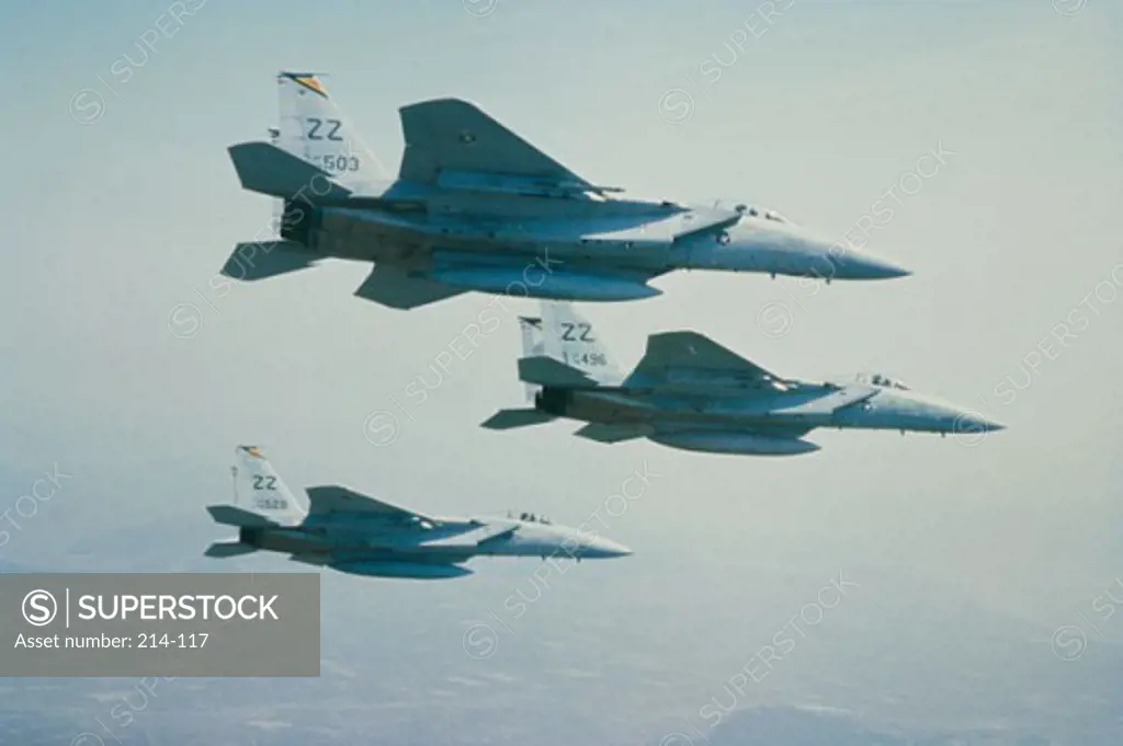 Low angle view of three F-15 Eagle fighter planes flying in formation