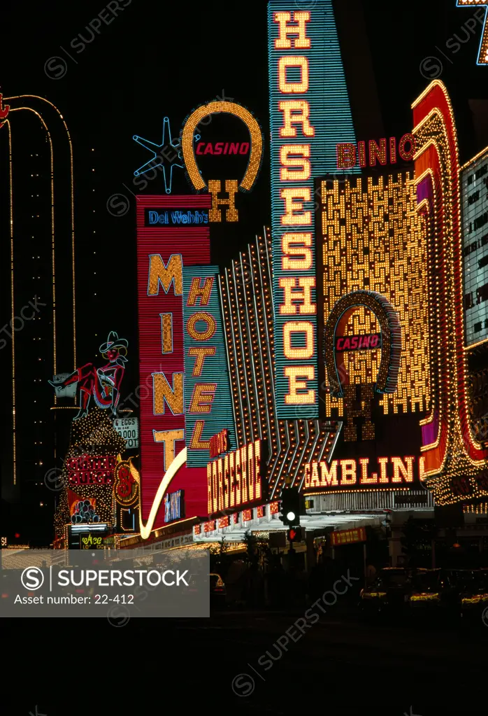 Neon signs of hotels and casinos lit up at night, Las Vegas, Nevada, USA
