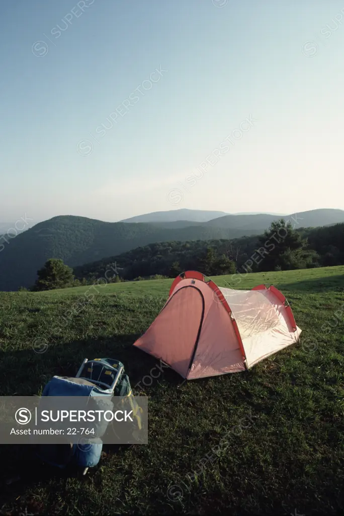 Backpacks with a dome tent on a hill, Blue Ridge Mountains, Virginia, USA