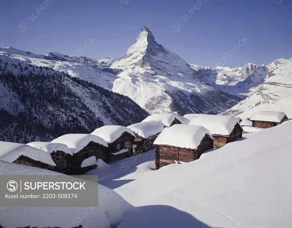 Houses covered with snow, Matterhorn, Switzerland