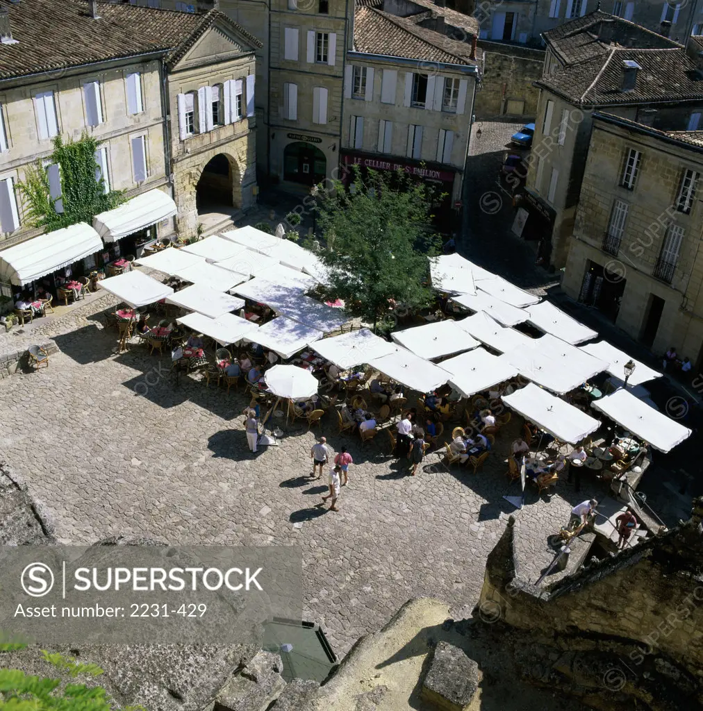 High angle view of people at an outdoor cafe, Place du Marche, St. Emilion, France