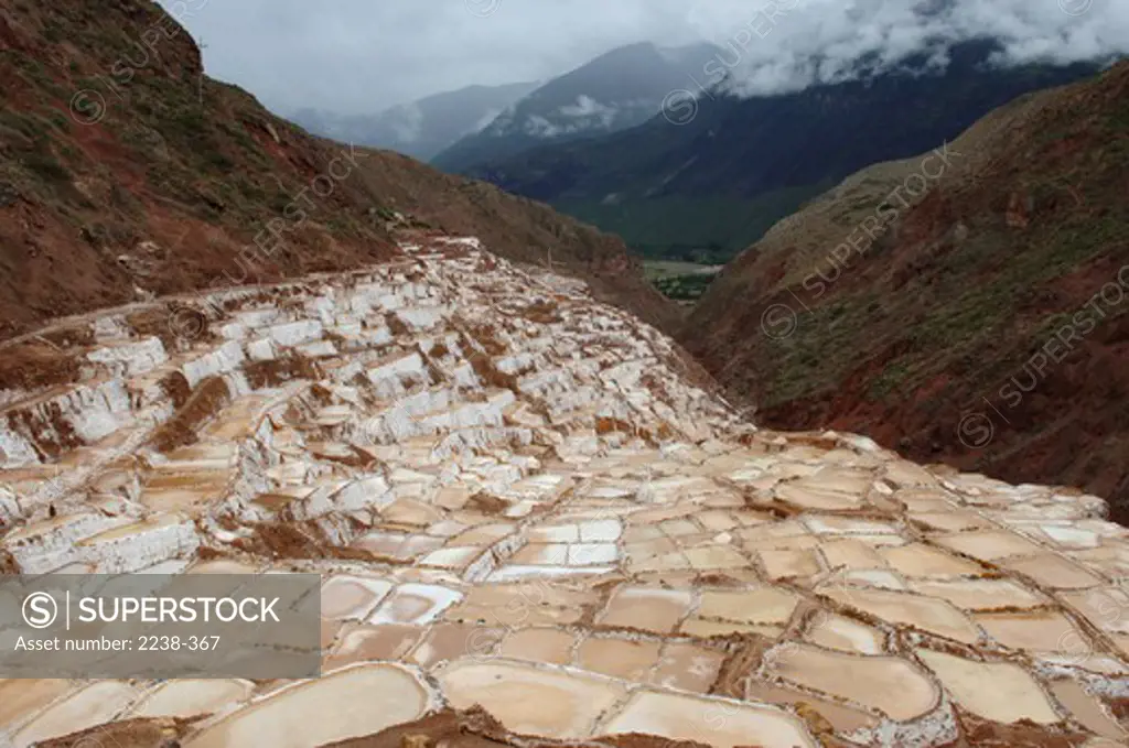 Terraced salt ponds at the mountainside, Andes, Urubamba Province, Cusco Region, Peru