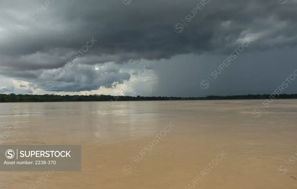Cumulonimbus clouds over the river, Ucayali River, Loreto Region, Peru