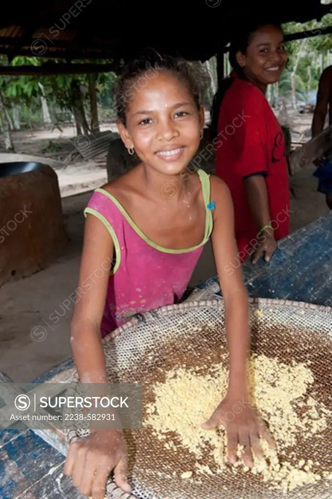 Sieve made with petiole strips of aruma (Ischnosiphon obliquus) for sieving dough of manioc cv Catombo. Marcia, 12 yrs. Casa da farinha. Santo Antonio de Ipapucu, Lago de Tefe, Amazonas, Brazil, 8-27-12
