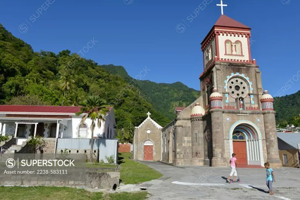 Catholic church in a village. Coconut (Cocos nucifera). Girl with scooter. Soufriere, Dominica 12-20-12