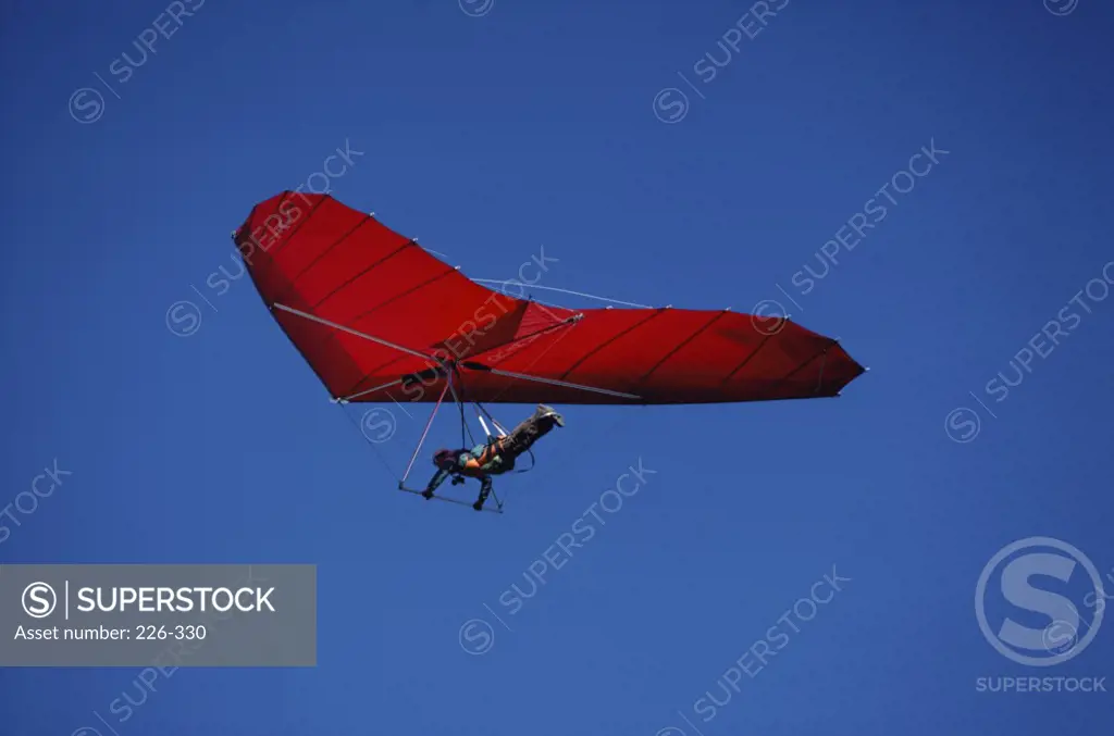 Low angle view of a man gliding