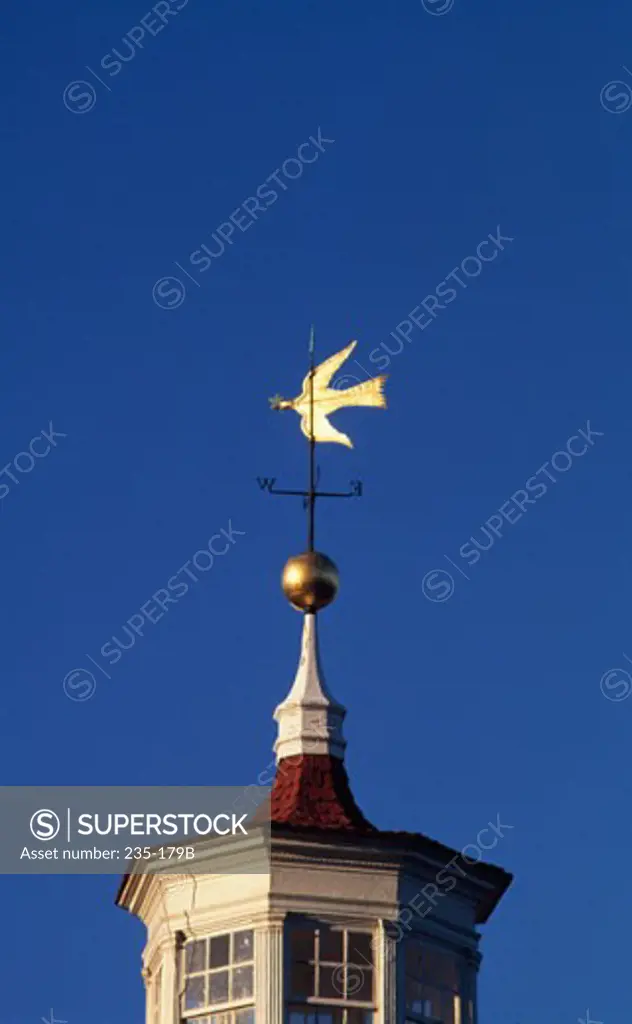 Low angle view of a weather vane on a building