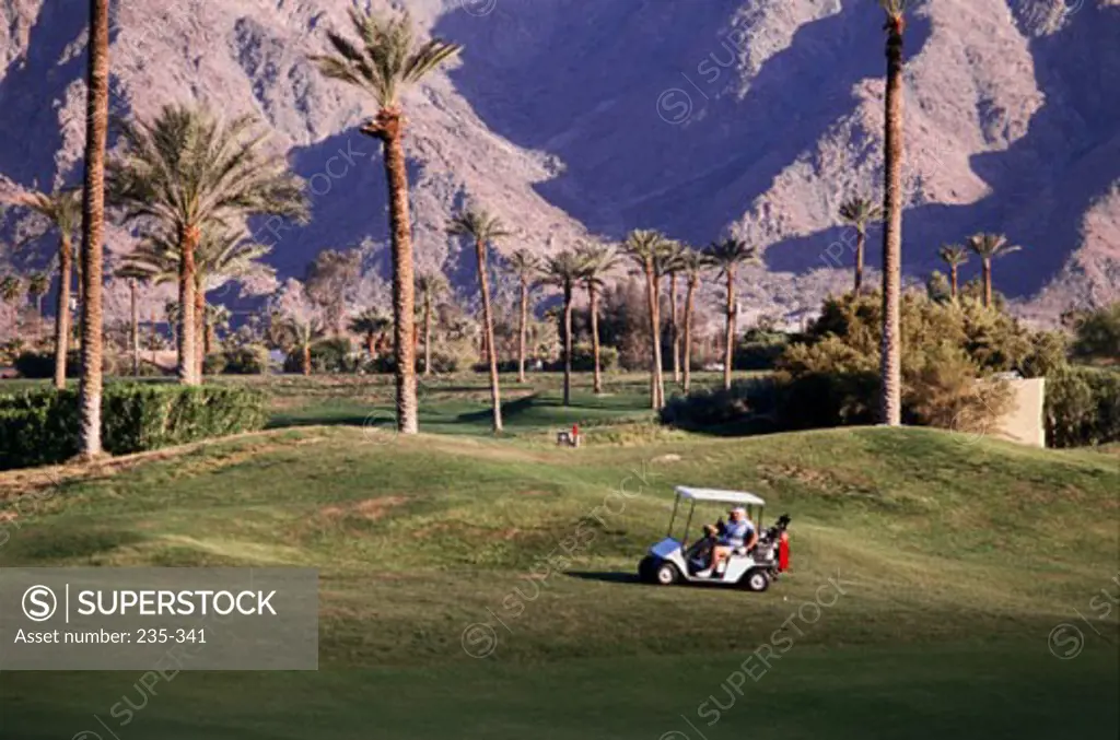 High angle view of a person driving a golf cart on a golf course, La Quinta Golf Course, La Quinta, California, USA