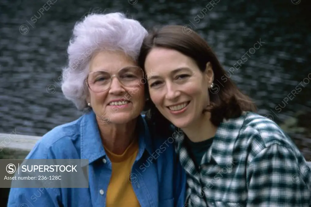 Portrait of a senior woman with her daughter smiling