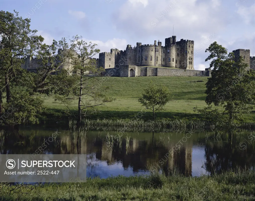 Reflection of a castle in water, Alnwick Castle, Northumberland, England